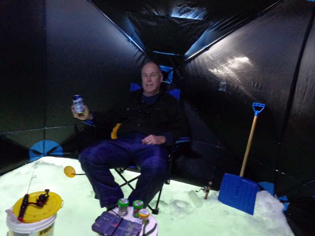 R Karl sitting in ice shelter