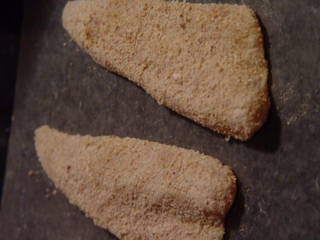 walleye fillets coated with breadcrumbs and flour